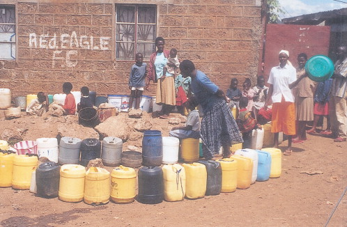 Figure 1. People queuing for water at Kawangware, on the outskirts of Nairobi. The Athi Water Services Board (AWSB) is also carrying out a rehabilitation project of pumping facilities at Kabete on the outskirts of the capital. (Picture courtesy of Wikimedia and the National Irrigation Board of Kenya.)