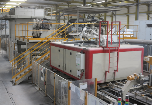 Vibrating press in a “Diresco Stone” production line with Busch vacuum unit installed above the press.