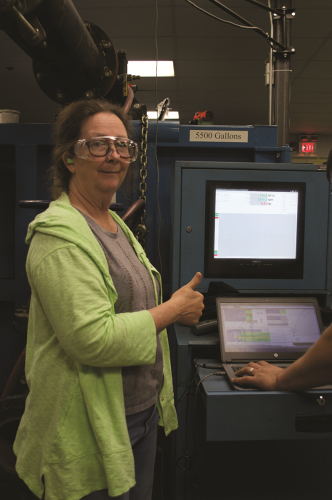 LeEllen Phelps, NSO Thermal Systems Manager, signals that the pumps passed all required factory-acceptance tests.