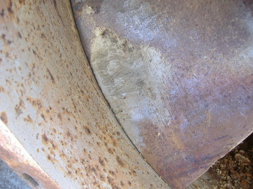Detail of erosion on the front of the impeller blade. The coarse pitting on the surface of the blades led to a loss in pump efficiency and even to reduction in the mechanical strength of the blades.