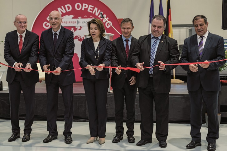 Cutting the ribbon at the inauguration ceremony.