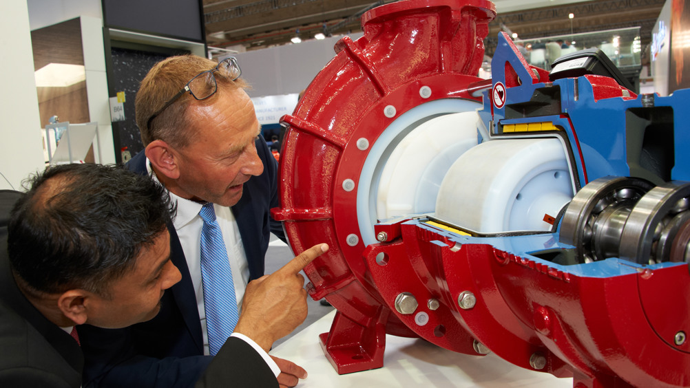 Attendees inspecting a magnetic drive pump at ACHEMA 2018.