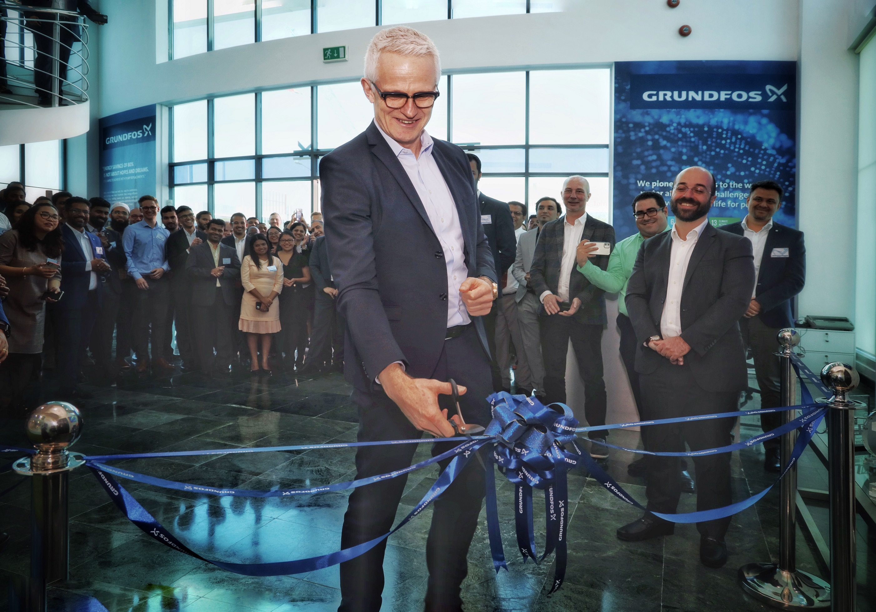Grundfos CEO Mads Nipper cutting the ribbon at the inauguration of the iFoss Lab in Dubai.