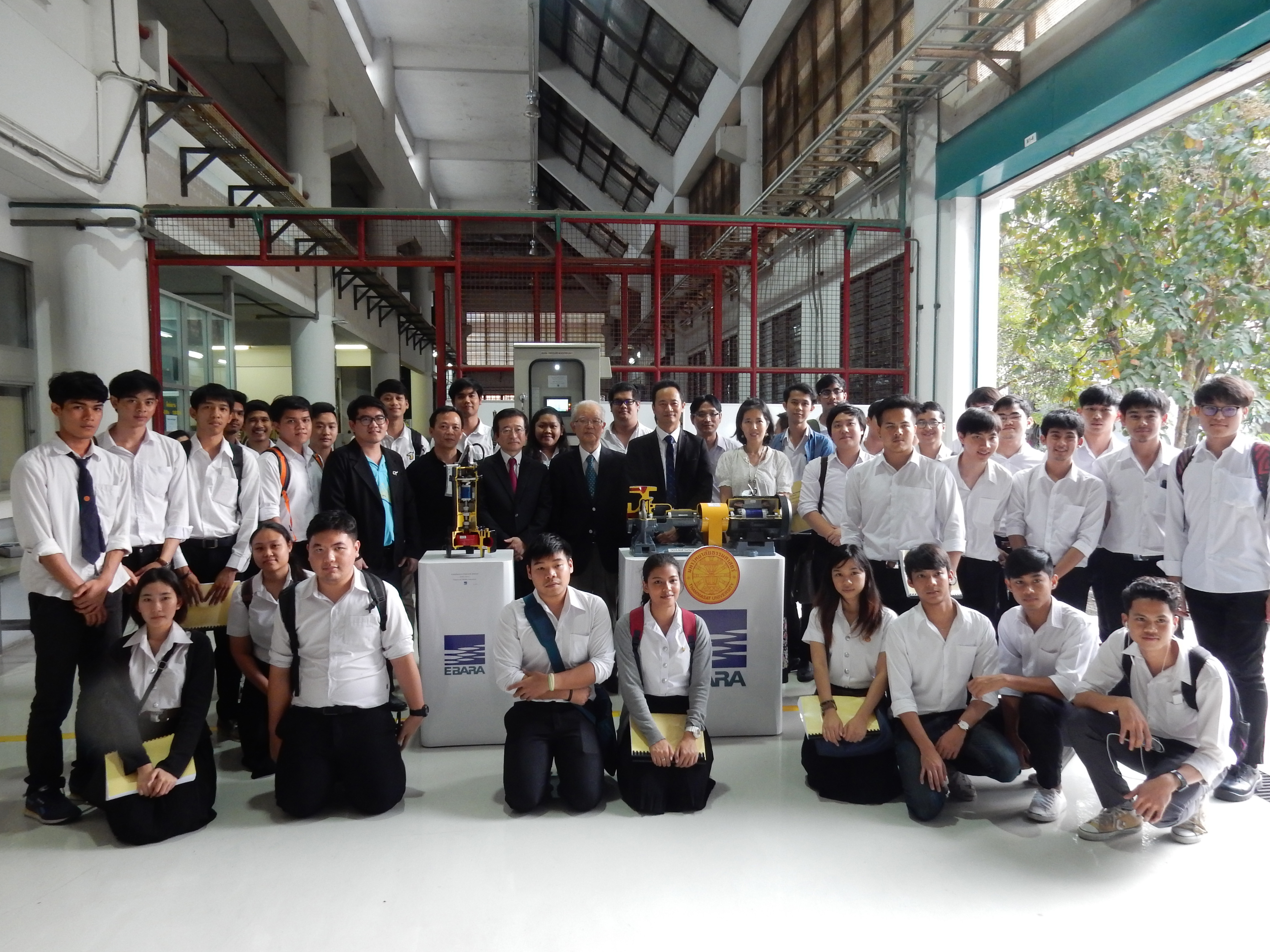 Thammasat University students with the pumps Ebara has donated.