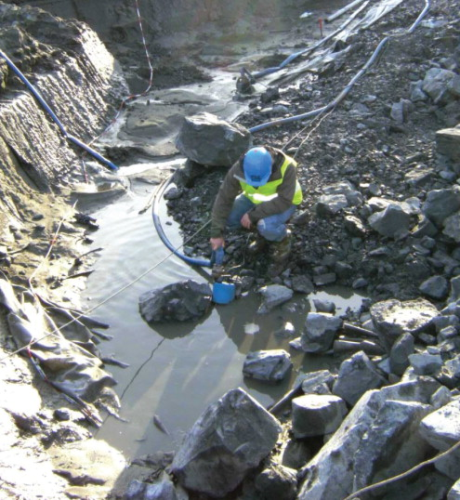 One of the archaeology team dealing with a semi-submerged Tsurumi drainage pump