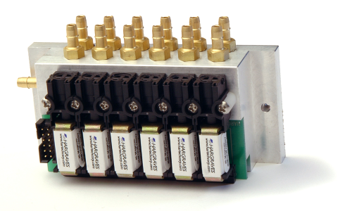 The Hargraves 10 mm Magnum solenoid valves, seen here manifold mounted, can be configured with a large orifice (0.075 in/1.9 mm) providing the pump with a less-restrictive flow path.