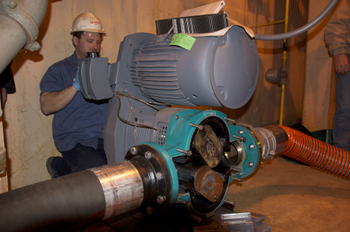 A Veolia maintenance engineer checking the Netzsch Tornado T2 Rotary Lobe Pump during routine maintenance. Note the easy access to rotors from front of the pump.