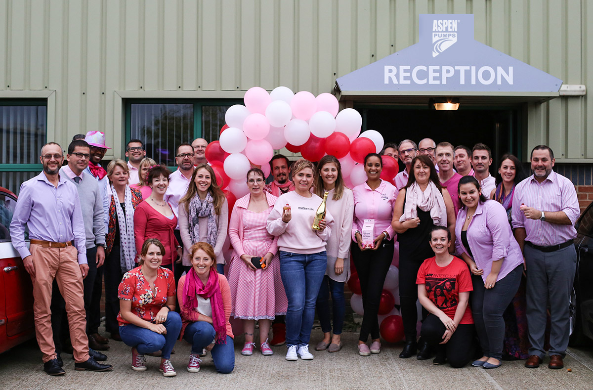 Aspen Pumps staff pictured raising money on 'Wear it Pink' day to fund breast cancer research.