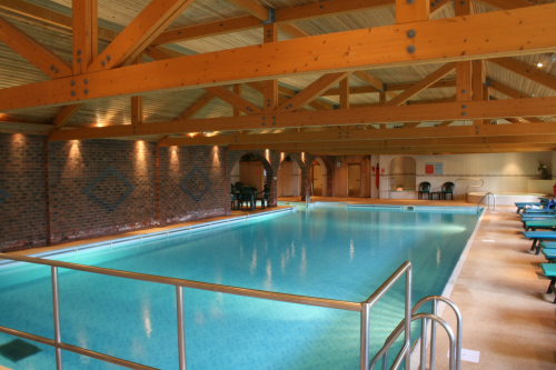 Customers relaxing next to the health club's  pool.