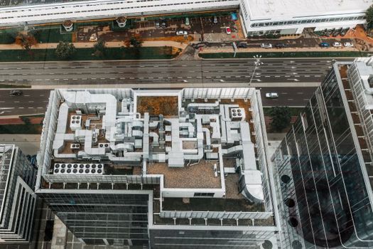 Aerial view of HVAC system on the roof top of an office building. 