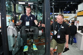 Delegates trying out equipment at the CONEXPO-CON/AGG 2014.