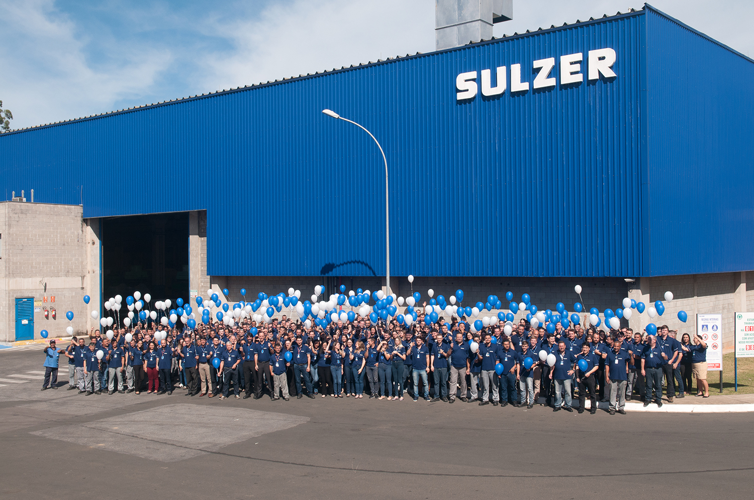 Sulzer employees celebrate 70 years in Brazil. Image copyright Sulzer.