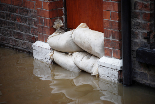 One of the best ways to tackle flooding is by using submersible pumps to clear water quickly away. Courtesy of Yorkman/Shutterstock.