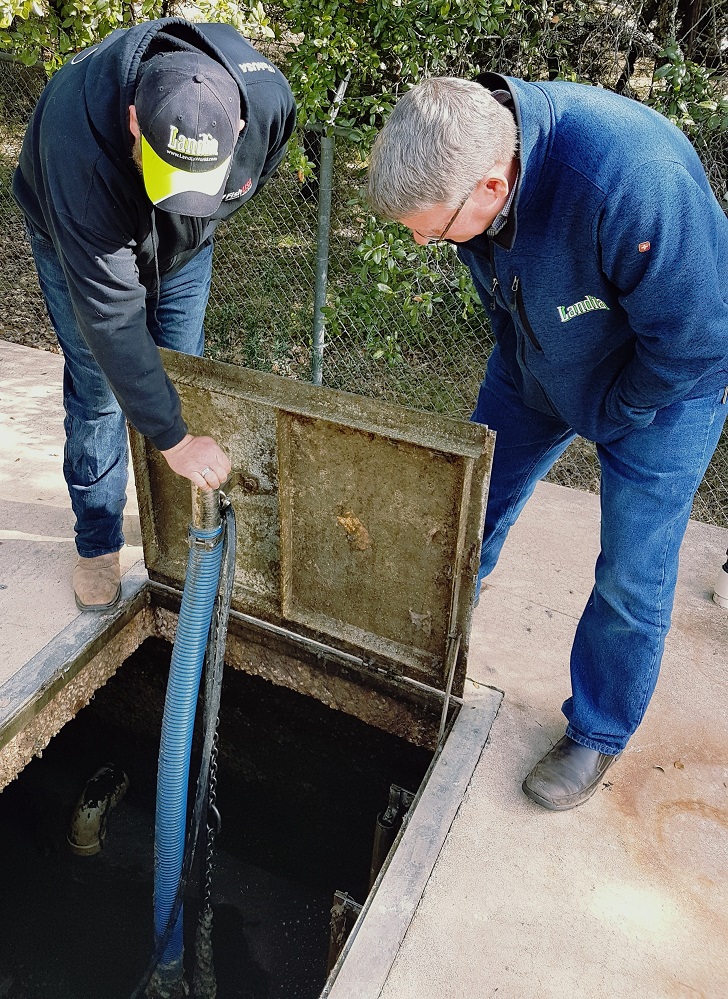 At the Deer Haven lift station in Llano County, Texas, Tim Webb, Operations manager (left) with Art Savage from Landia (right).