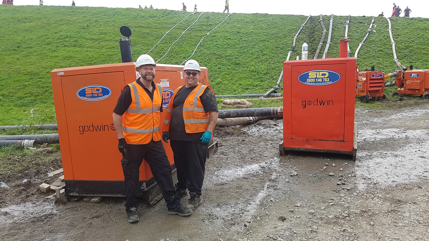 Simon Flevill service engineer/driver (left) and Ian Turner, supervisor Service (right) with the diesel pumps draining water out of Toddbrook.