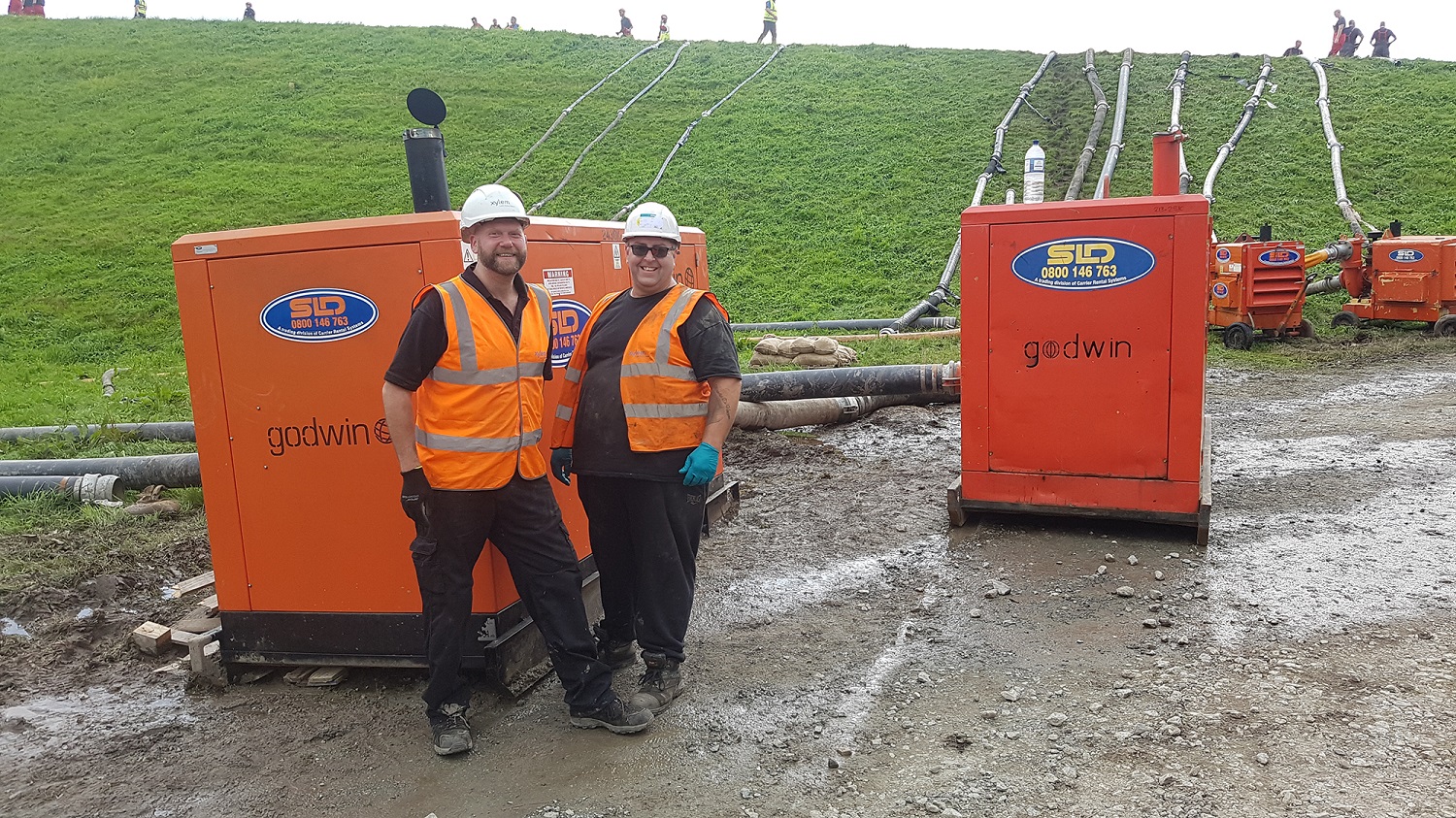 Simon Flevill service engineer/driver (left) and Ian Turner, supervisor Service (right) with the diesel pumps draining water out of Toddbrook.