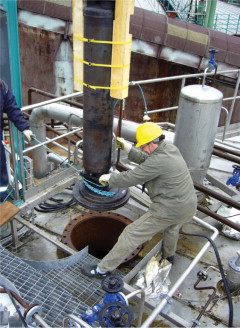 The manhole situated on top of the tank.