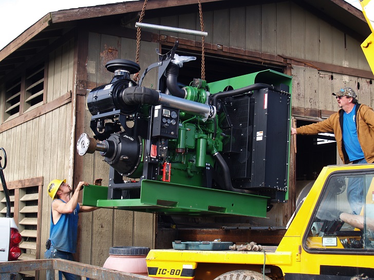 The team at Groundwater Pump & Well prepare to install a 450 horse power forest protection engine for a 4500 GPM Pump.