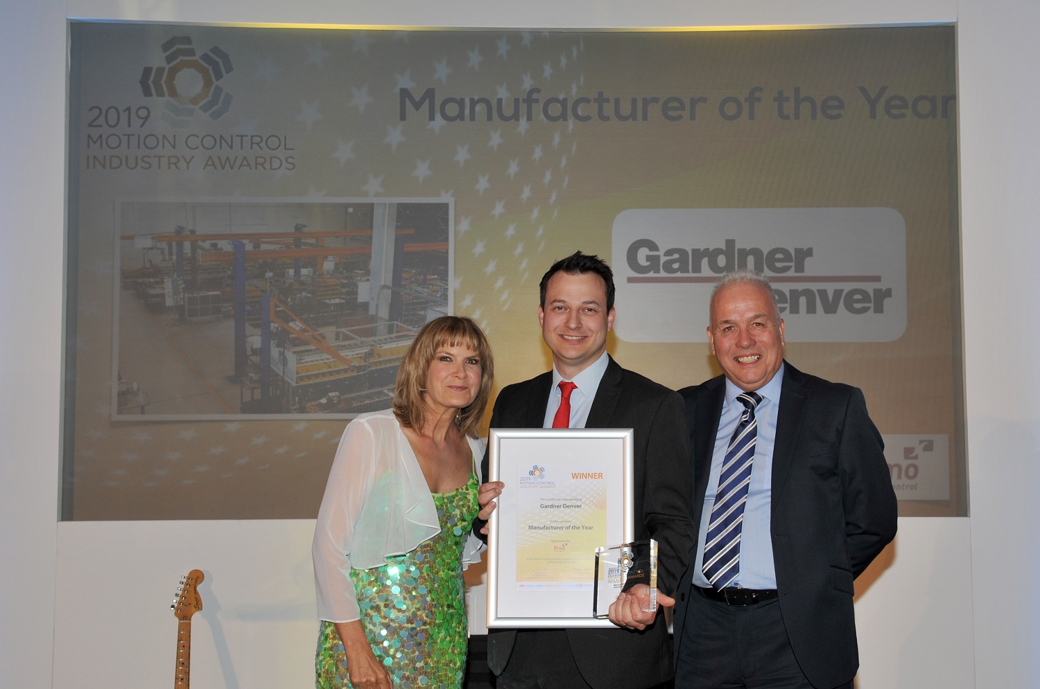 Tom Green (centre), marketing manager – Industrials at Gardner Denver, collects  the Manufacturer of the Year award at the 2019 Motion Control Industry Awards.