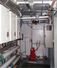 Figure 3. A view inside one of the packaged plant rooms, with pumps visible at the rear.