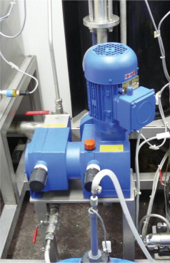 Figure 2b. The centralized coating preparation - (L) de-ionized water line, and (center-R), one of the HP centrifugal pumps feeding the stainless steel circular manifold.