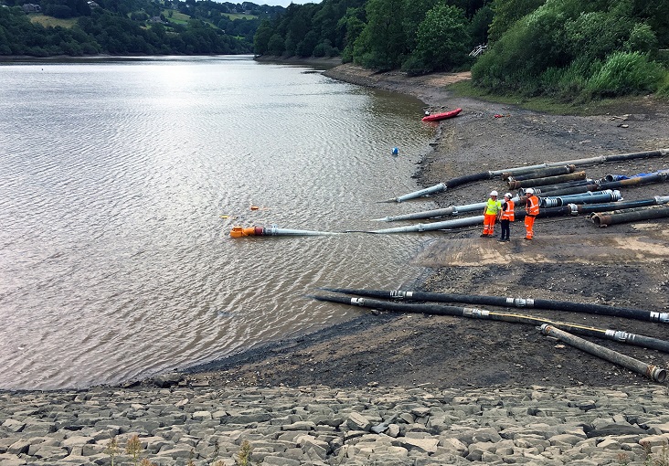 The flexible hoses extracting water at the Toddbrook Reservoir.
