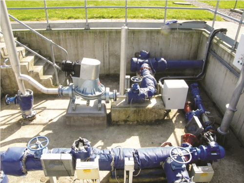 The variable-speed drive with the patented sludge pump control algorithm is housed in the enclosure top right. A progressive cavity pump on a timer was replaced by a diaphragm pump, top left.